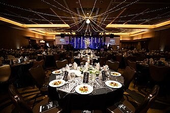 a large room with tables set for a meal